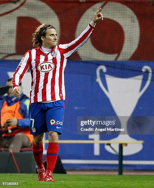 Diego Forlan of Atletico Madrid celebrates after scoring during the La Liga match between Atletico Madrid and Valencia at Vicente Calderon Stadium on...