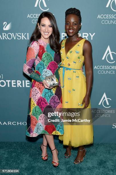 Micaela Erlanger and Lupita Nyong'o pose backstage at the 22nd Annual Accessories Council ACE Awards at Cipriani 42nd Street on June 11, 2018 in New...