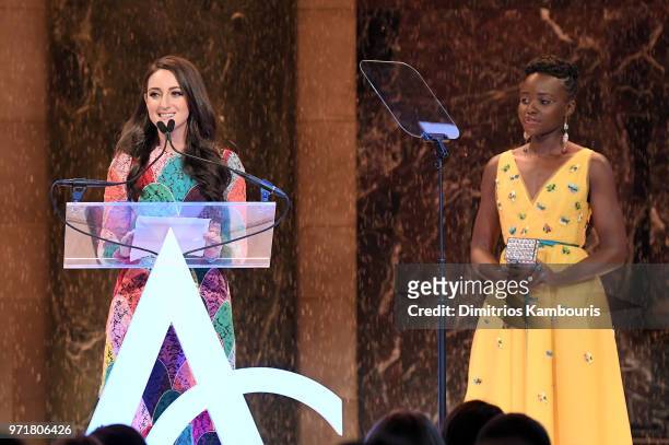 Micaela Erlanger accepts an award onstgae from Lupita Nyong'o during the 22nd Annual Accessories Council ACE Awards at Cipriani 42nd Street on June...