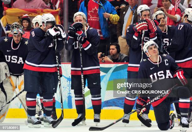 Team members look dejected following their 2-3 loss to Canada in the Men's Gold Medal Hockey match at the Canada Hockey Place during the XXI Winter...