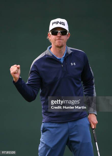 Hunter Mahan reacts after making his birdie putt on the 16th hole during the final round of the Waste Management Phoenix Open at TPC Scottsdale on...