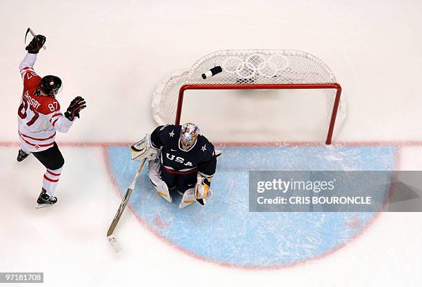 Canadian forward Sidney Crosby scores the winning goal celebrating their win in the Men's Gold Medal Hockey match at the Canada Hockey Place during...