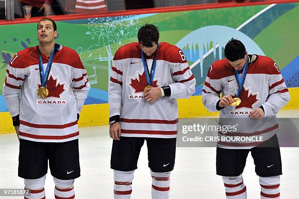 Canadian forward Ryan Getzlaf wear their gold medals during the medals ceremony in the Men's Gold Medal Hockey match against the USA at the Canada...