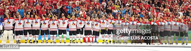 Canadian players attend the medal ceremony after their victory over the US in the men's gold medal Ice Hockey match against the US at Canada Hockey...