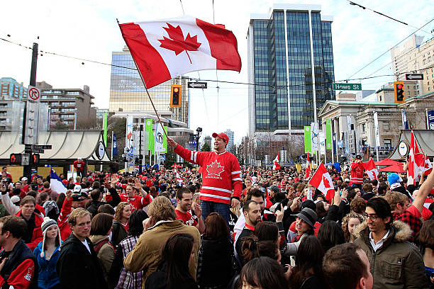 Hockey fans celebrate team Canada's 3-2 victory over the USA after the ice hockey men's gold medal game on day 17 of the Vancouver 2010 Winter...