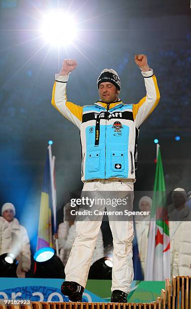 Axel Teichmann of Germany receives the silver medal during the medal ceremony for the men's 50 km, mass start cross-country skiing held during the...