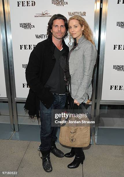 Actor Greg Lauren and actress Elizabeth Berkley arrive at the FEED Foundation/Hungry In America project benefit hosted by Vanity Fair held at Craft...