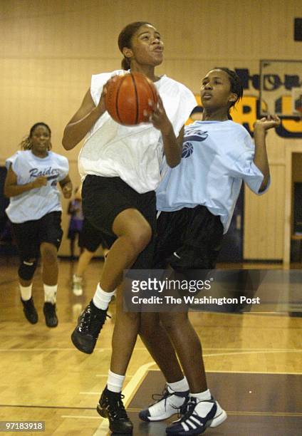 GHoops14 Kevin Clark/The Washington Post Date: 8.05.2003 Neg #: 145467 Upper Marlboro, MD Janae Butler of Arundel attempts a shot with Keshia Wright...