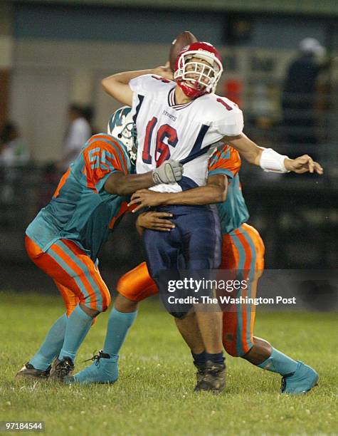 Kevin Clark/The Washington Post Date: 9.05.2003 Neg #: 146509 Westlake High School, Waldorf, MD Northern's Sean Schaefer is sacked and fumbles due to...