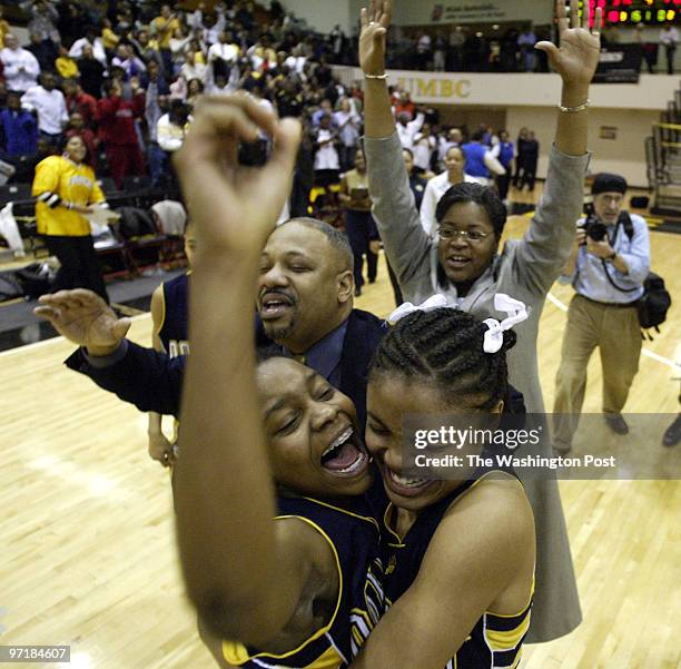 Sp-mdgirls14 Catonsville, Md Mark Gail_TWP Potomac's top scorer Juantale Cook celebrates with teammate Dannielle Shearin as head coach Micheal...