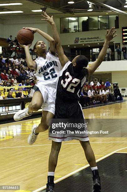 Sp-mdgirls14 Catonsville, Md Mark Gail_TWP Arundel's Janae Butler scores two of her 25 points in the victory against Woodlawn in the Class 4A finals...