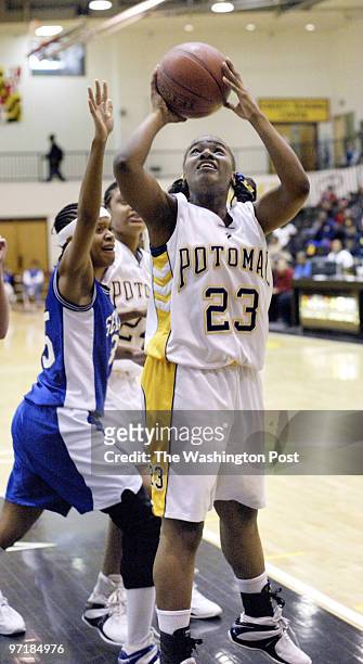 Sp-mdgirls13 Catonsville, Md Mark Gail_TWP Potomac's Candance Elam shoots over the hand of Stephen Decatur's Erica Beckett in the Class 2A semifinals...