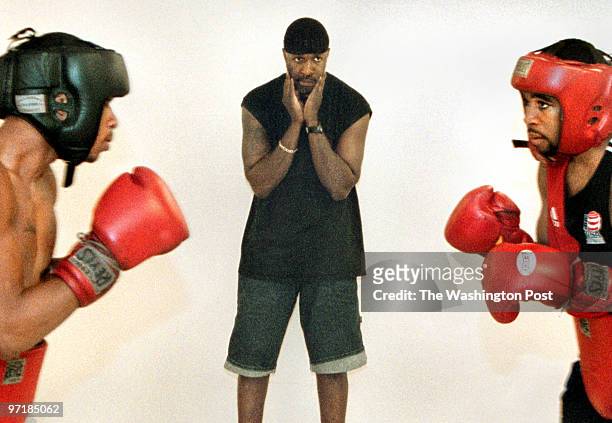 Boxing brothers Anthony and Lamont Peterson spar during a training session under the watchful eye of trainer Barry Hunter at the Bald Eagle Rec...