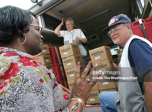 Representatives from the American Red Cross were dispensing meals to neighborhoods still without power. Pictured, Camilla Thornton, left, of...