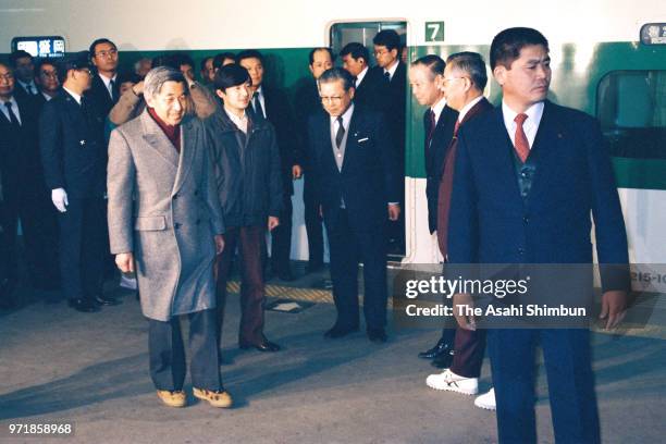 Crown Prince Akihito and Prince Naruhito are seen on arrival at JR Morioka Station on the way to Hachimantai Ski Resort on February 27, 1988 in...