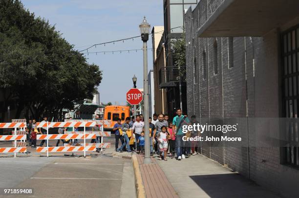 Central American immigrants depart ICE custody, pending future immigration court hearings on June 11, 2018 in McAllen, Texas. Thousands of...