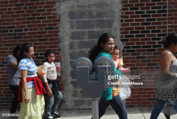 Central American immigrant families depart ICE custody, pending future immigration court hearings on June 11, 2018 in McAllen, Texas. Thousands of...