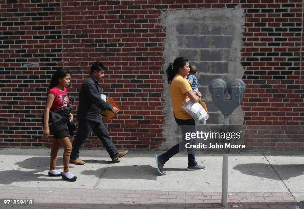 Central American immigrant families depart ICE custody, pending future immigration court hearings on June 11, 2018 in McAllen, Texas. Thousands of...