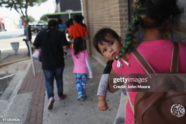 Central American immigrant families depart ICE custody, pending future immigration court hearings on June 11, 2018 in McAllen, Texas. Thousands of...