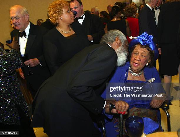 Washington, D.C. National Council of Negro Women founder Dorothy Height gets a welcoming kiss from comedian and activist Dick Gregory at a...