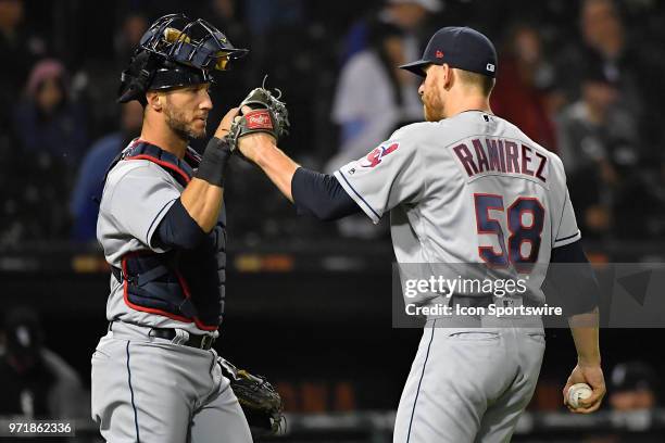 Cleveland Indians catcher Yan Gomes and Cleveland Indians relief pitcher Neil Ramirez celebrate after winning against the Chicago White Sox on June...