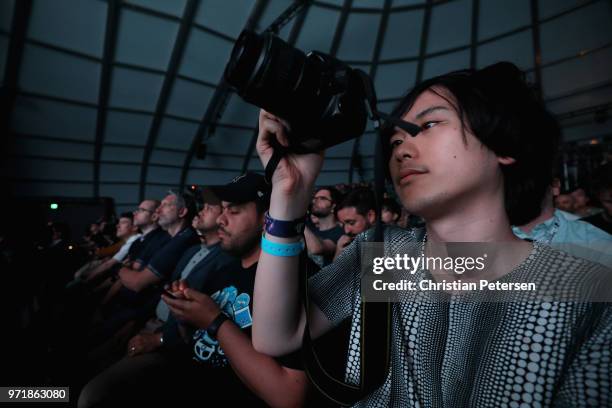 Game enthusiasts and industry personnel attend the Sony Playstation E3 conference at LA Center Studios on June 11, 2018 in Los Angeles, California....