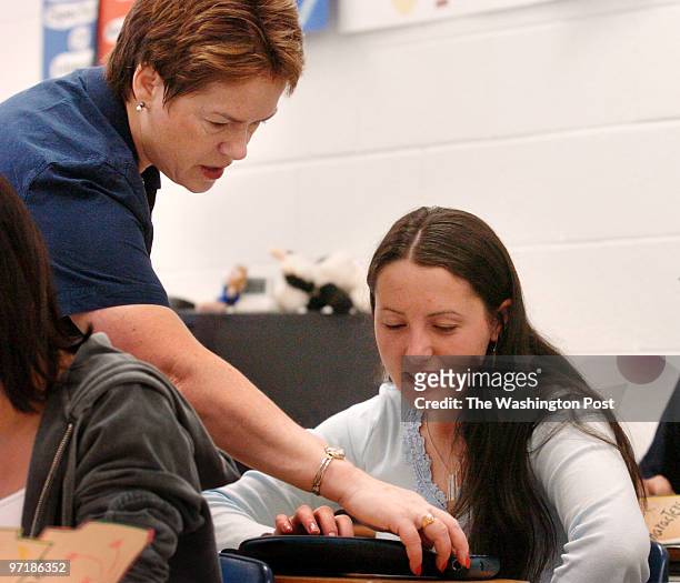 May 6, 2004 photog: Gerald Martineau Osborn High School, Manassas, VA neg: 155104 ESL class for SOL test Teacher Joyce Johnston assists Mireme Morina...