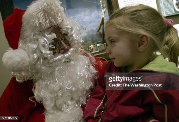 Sm-trains 12-13-03 Mark Gail_TWP Caption-Mary Alice Christopher talks with Santa at the Christmas open house at the St.Clement's Island-Potomac River...