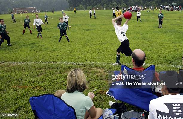 Kevin Clark\The Washington Post Neg #: 158806 Crofton, MD Parents watch from the sidelines during the Crofton Shootout Soccer Tournament Saturday...