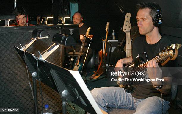 Life in the orchestra pit during the ABBA musical "Mamma Mia!" during pre-opening night run-through at the National Theatre. Guitarist Paul Pasmore...