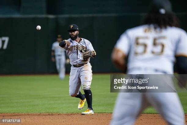 Pittsburgh Pirates second baseman Josh Harrison throws the ball to first base during the MLB baseball game between the Pittsburgh Pirates and the...