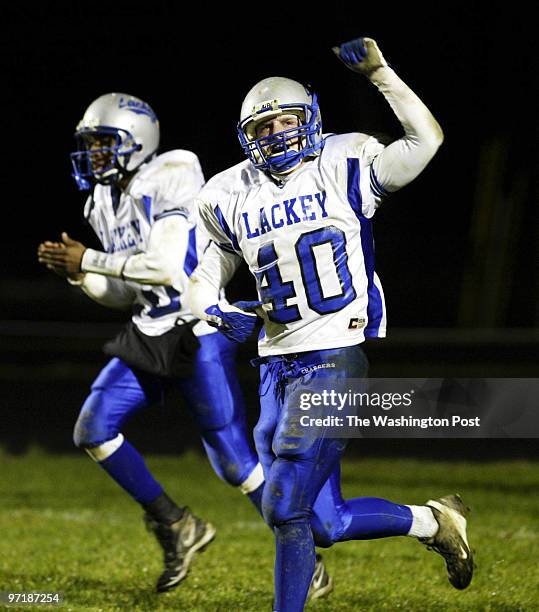 Sm-foota23 11-21-03 Mark Gail_TWP Lackey's Bryan Gibbons celebrates after scoring a touchdown on a blocked punt by teammate Robert Matthews in the...