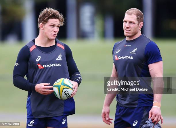 Michael Hooper talks to David Pocock of the Wallabies during an Australian Wallabies training saession on June 12, 2018 in Melbourne, Australia.
