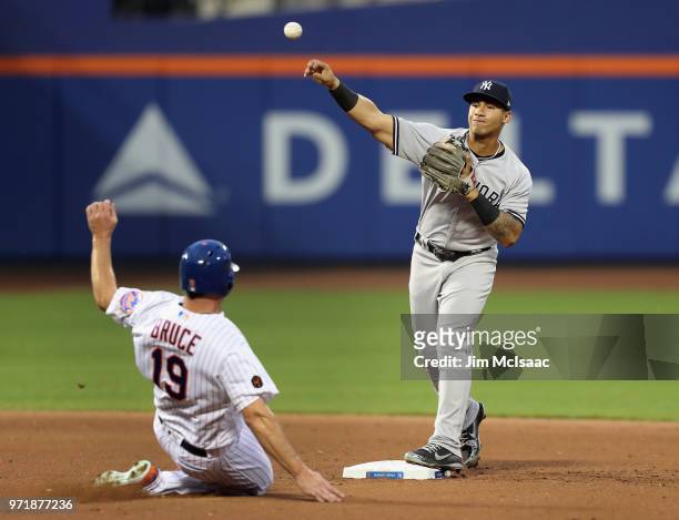 Gleyber Torres of the New York Yankees in action against Jay Bruce of the New York Mets at Citi Field on June 8, 2018 in the Flushing neighborhood of...