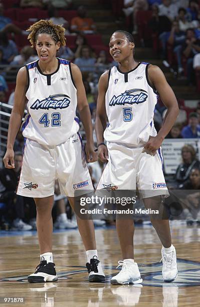 Nykesha Sales and Elaine Powell of the Orlando Miracle talk during the game against the New York Liberty on June 23, 2002 at TD Waterhouse Centre in...