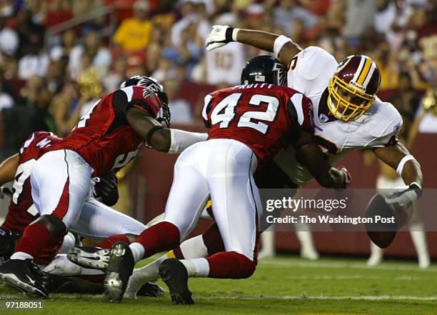 Neg#:159132 Photog:Preston Keres/TWP FedEx Field, Landover, Md. Atlanta's Etric Pruitt knocks the ball out of Redskins' Ladell betts, but not until...