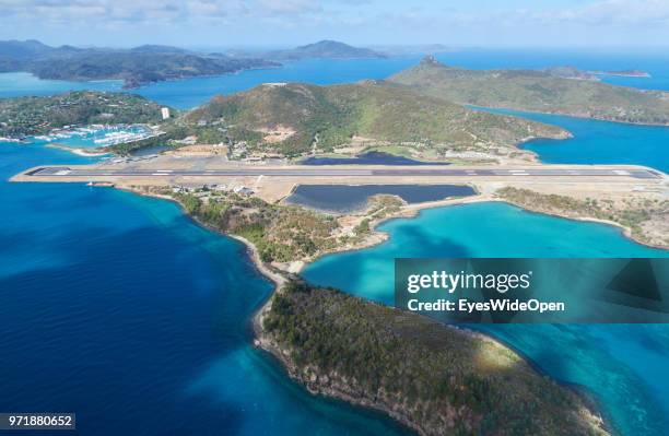 Aerial view of Hamilton Island and the airstrip at the east coast and the pacific ocean on November 20, 2015 in Whitsunday Islands, Australia.