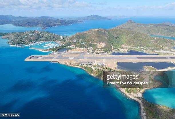 Aerial view of Hamilton Island and the airstrip at the east coast and the pacific ocean on November 20, 2015 in Whitsunday Islands, Australia.