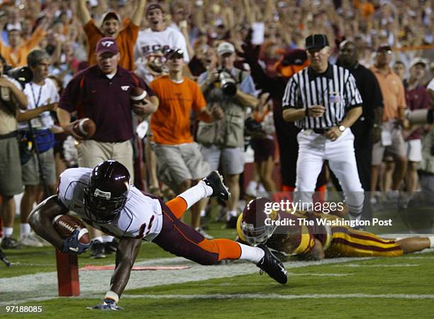 Neg#:158952 Photog:Preston Keres/TWP FedEx Field, Lancover, Md. Virginia Tech's Josh Hyman dives into the endzone past USC's Kevin Arbet for Tech's...