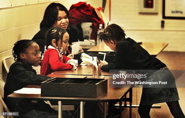 Photog: Gerald Martineau Jefferson-Houston Elem. School Alex, VA neg: 152139 kids run credit union Student credit union clerks Corretta Wright and...