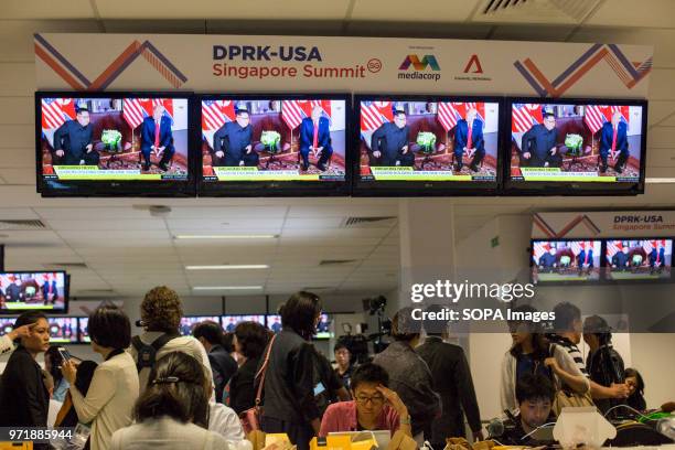 Journalists report from the International Media Center as the unprecedented meeting between US President Donald Trump and DPRK Chairman Kim Jong Un...