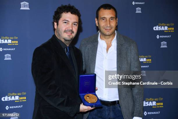 Pedro Paulo de Andrade and Zinedine Soualem attend the 'Les Nuits En Or 2018' dinner gala at UNESCO on June 11, 2018 in Paris, France.