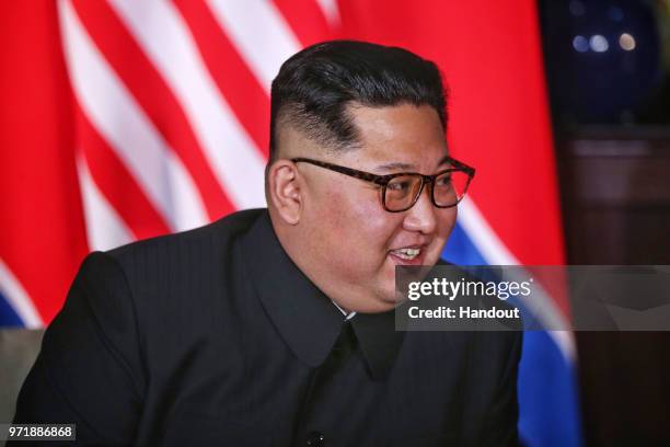 In this handout photograph provided by The Strait Times, North Korean leader Kim Jong-un during a historic U.S.-DPRK summit with U.S. President...