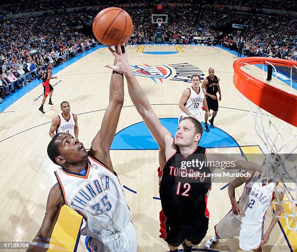 Kevin Durant of the Oklahoma City Thunder attempts to shoot over Rasho Nesterovic of the Toronto Raptors on February 28, 2010 at the Ford Center in...