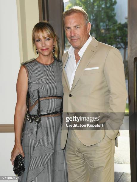 Kevin Costner and Christine Baumgartner attend the premiere of Paramount Pictures' "Yellowstone" at Paramount Studios on June 11, 2018 in Hollywood,...