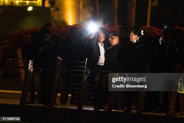 North Korean leader Kim Jong Un, center right, stands for a selfie photograph with Vivian Balakrishnan, Singapore's foreign affairs minister, while...