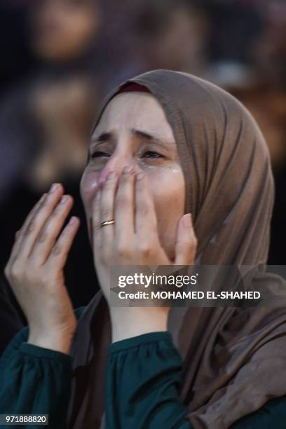 Muslim woman takes part in the evening prayers at Laylat al-Qadr or Night of Destiny, during the holy fasting month of Ramadan, at al-Azhar mosque in...