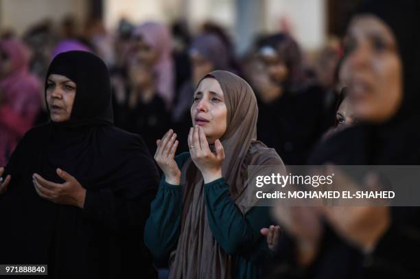 Muslim women take part in the evening prayers at Laylat al-Qadr or Night of Destiny, during the holy fasting month of Ramadan, at al-Azhar mosque in...