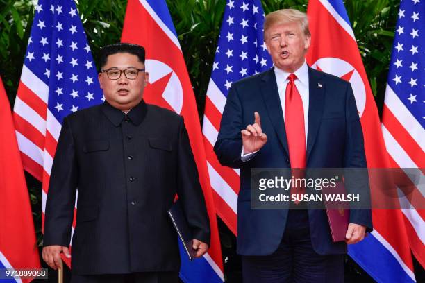 President Donald Trump makes a statement before saying goodbye to North Korea leader Kim Jong Un after their meetings at the Capella resort on...