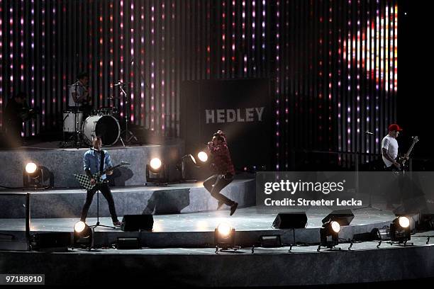 Chris Crippin, Tommy Mac, Jacob Hoggard and Dave Rosin of Hedley perform during the Closing Ceremony of the Vancouver 2010 Winter Olympics at BC...